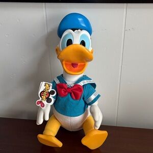 Disney 90s Donald Duck Plush Toy with Vinyl head, hands, & feet 
RARE WITH TAGS